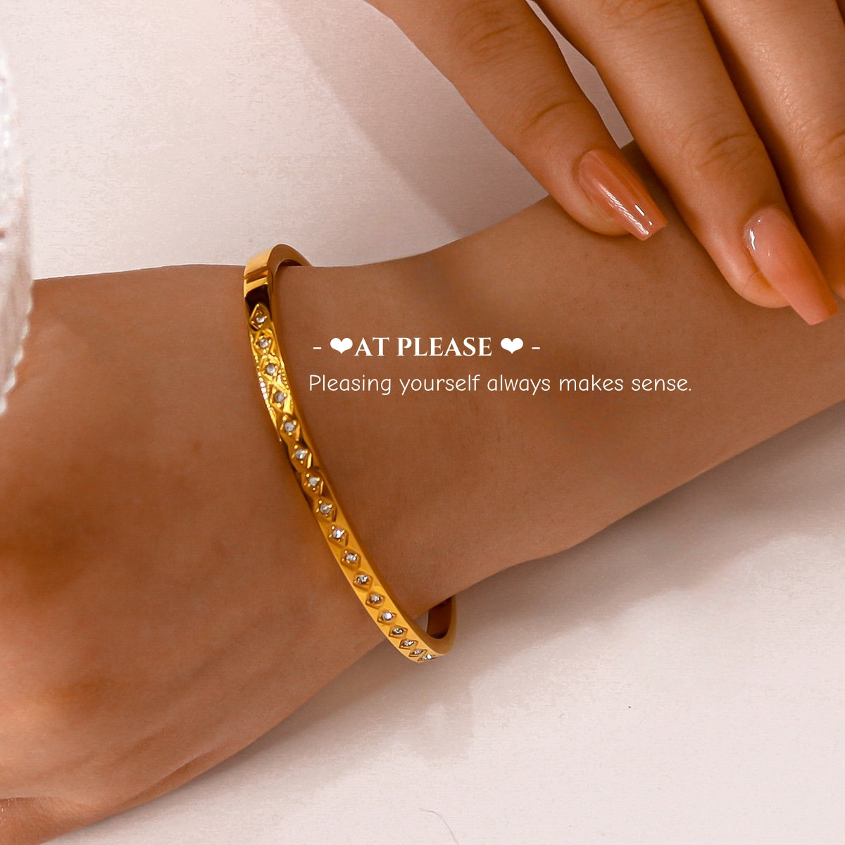 Diamond-studded geometric clasp on narrow gold plated bangle