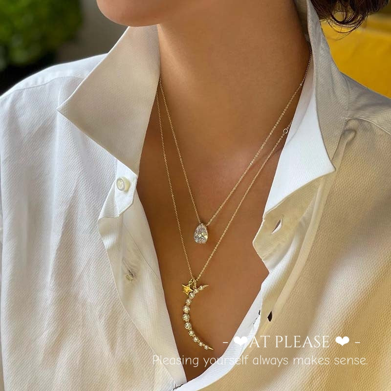 elegant women wearing S925 sterling silver star and moon pendant necklace with 18k gold plating and diamond accents, celestial jewelry